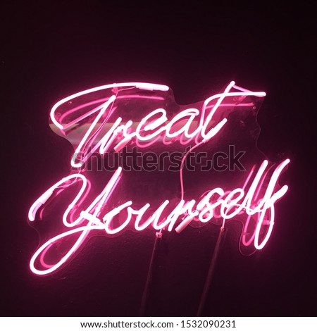 Treat Yourself cursive pink neon sign