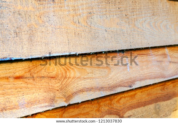 Treated wood antiseptic, a means of protection.\
Painted wooden boards to dry.\
