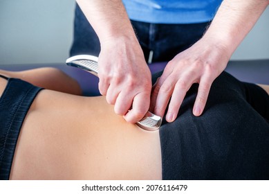 Treatment of sacroiliac joint dysfunction (SI joint pain) performed by osteopathic doctor, chiropractor applying manual procedures to lower back region