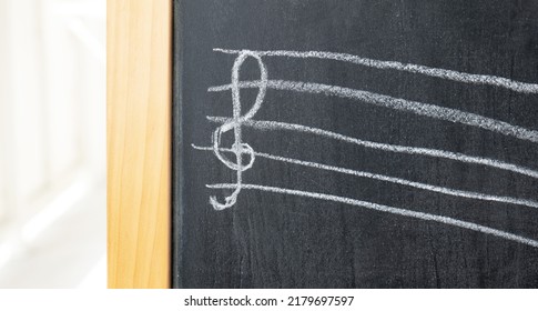 Treble Clef On A Chalkboard Drawn By A Child, Chalk Drawing, Object Detail, Closeup, Front View, Nobody. Music, Violin Clef Musical Symbols, Notation And Kids Education Abstract Concept, No People