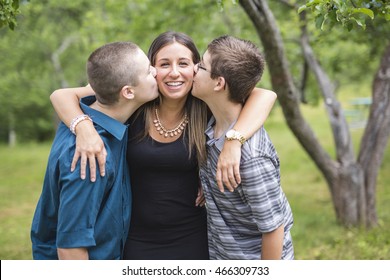 brother and sister hugging