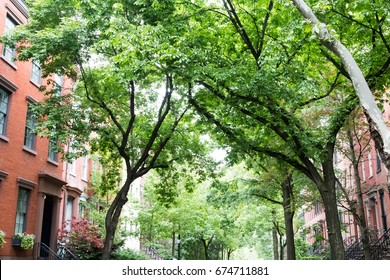 Tree Lined Residential Street In The Historic West Village Neighborhood Of Greenwich Village In Manhattan, New York City NYC