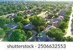 Tree lined residential street in upscale suburban Wentworth Estates neighborhood in West Plano, Texas, two-story single-family homes, swimming pool, suburbs Dallas Fort Worth metroplex, aerial. USA