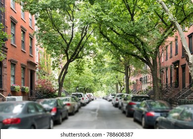 Tree Lined Street Of Historic Brownstone Buildings In A Greenwich Village Neighborhood In Manhattan New York City NYC
