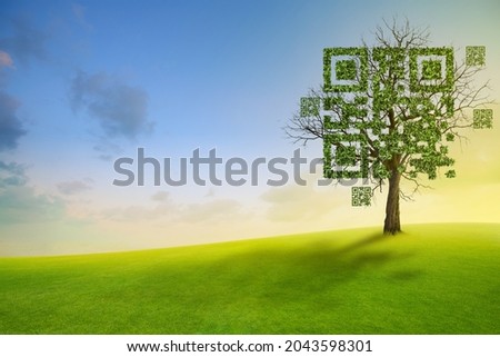 Tree shaped like qrcore with the green mountain and blue sky background. Technology ,Business and Nature Concept.