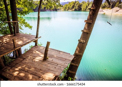 Treehouse wooden platform at a beautiful blue lake - Shutterstock ID 1666175434