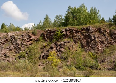 Trees Growing Over Hercynian Orogeny Geological Structures Inside Of Old Closed Quarry In Holly Cross Mountains In Poland