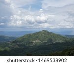 Trees, mountains, sky and clouds