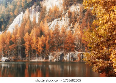 Trees on the shores of a mountain lake in The Adršpach-Teplice Rocks, Bohemia, Czech Republic, sandstone formations