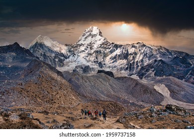 Trekkers Head Out To Ama Dablam Base Camp Under A Dramatic Sky On The Mount Everest Trekking Route, Himalayas, Nepal