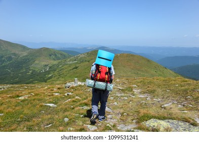 trekking with backpack in mountains