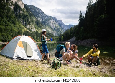 Trekking, Camping, Hiking And Wild Life Concept. Group Of Friends Are Hiking In Nature