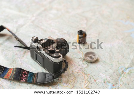 trekking map with analogic analog camera and compass, for travellers and explorer photographers of beatiful places on route and vacaction