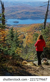 TREMBLANT, CANADA, October 4, 2022 : Youn Woman Admires Landscape During Fall Season. Mont Tremblant Ski Resort (commonly Referred To As Tremblant) Is A Year-round Resort In The Laurentian Mountains.