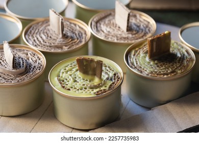 A trench candle is the name of a device for obtaining light, heating, drying clothes and cooking food in the form of a can, in which cardboard filled with wax or paraffin is placed. - Shutterstock ID 2257735983