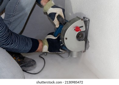 A Trench Grinding Machine For Grinding Wide Slots In Concrete Walls In Preparation For Laying PVC Pipes And Wiring For Electricity In Homes And Businesses