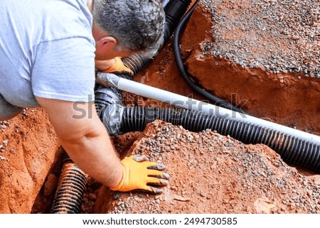 Trench underground is prepared for laying assembling drainage pipes for outflow of rainwater stormwater