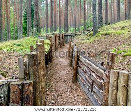 Trench warfare used in World Ware I in occupied fighting lines consisting largely of trenches, in which troops was significantly protected from the enemy's fire and artillery. Lozmetejkalns, Latvia.