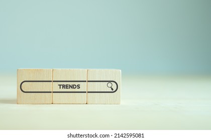 Trend Searching Concept. Searching Information Data On Internet Networking To Initiative Trends. Searching For Upcoming Business Trend, Seeking Opportunities For Investment. Wooden Cubes Background.