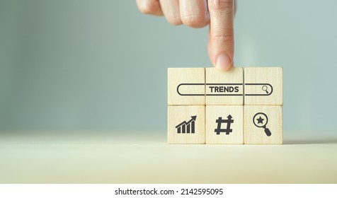 Trend Searching Concept. Searching Information Data On Internet Networking To Initiative Trends. Searching For Upcoming Business Trend, Seeking Opportunities For Investment. Wooden Cubes Background.