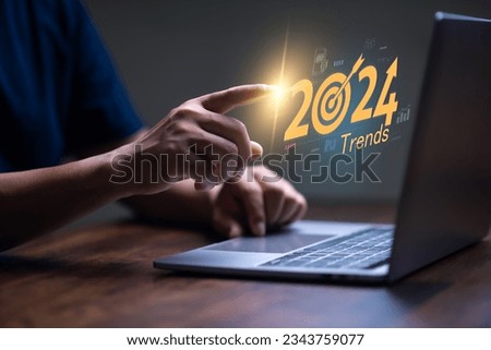 Trends for 2024 concept, Businessman show 2024 trends  for marketing monitor and business planing in new year concept. marketing trends, Design .