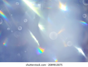 Trendy abstract Very Peri colour background with rainbow flares, bokeh orbs, and light leaks