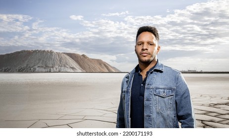 Trendy African Black Man Against  Mountains In Stylish Classic Jean Jacket With Fashionable Hairstyle Handsome Man Model Portrait Fashion Concept Mens Clothing