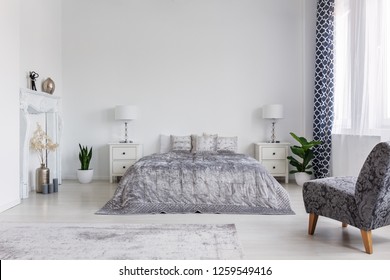 Trendy Armchair In Bedroom Designed In New York Style, Real Photo With Copy Space