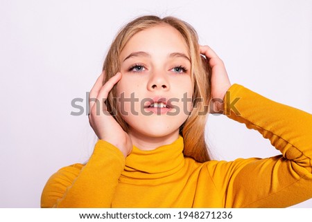Trendy beautiful hipster girl. Photo of positive young nice woman in yellow knee-high with white background. dreaming
