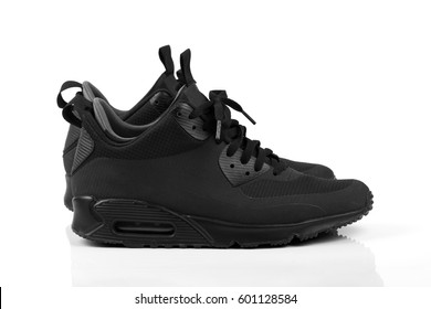 trendy black casual sneakers isolated on white background