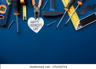 
Trendy Blue Background With Tools,
Black Mustache And Heart With The Inscription: 