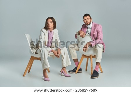 Similar – Image, Stock Photo A fashionable couple, dressed in white and wearing avant-garde shoes, is having some fun in the green meadow. With a cow. It’s a great outdoor wanderlust at its best. On a wild summer night.