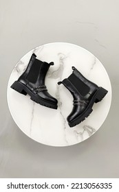 Trendy Chelsea Black Boots. Fashion Still Life. Demi-season Leather Shoes