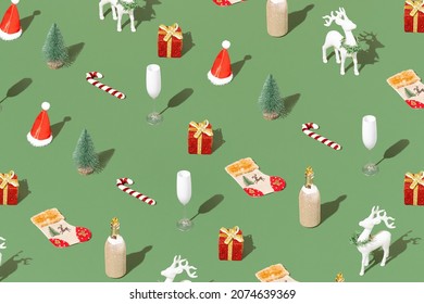 Trendy Christmas pattern with Christmas decorations, a bottle of champagne, a glass and a reindeer on a pastel green background. Minimal New year holiday wallpaper