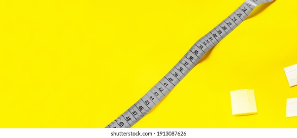 The trendy color of 2021. Tailoring concept. Accessories for sewing and needlework. measuring tape and chalk. copy space - Powered by Shutterstock