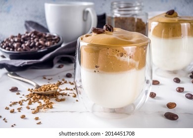 Trendy Drink, Dalgona Coffee. Whipped Instant Coffee Drink With Cold Milk And Sugar. Fluffy Creamy Whipped Coffee Beverage, On White Background, Copy Space