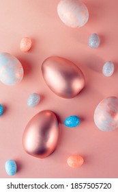 Trendy Easter background and Gold   colored Easter eggs light coral color background and copy space for text  Top view flat lay still life  Easter concept 
