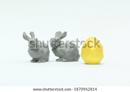 Trendy Easter low poly decor - golden egg and green bunnies of geometric style. Happy Easter greeting card. Holiday concept in minimal style.
