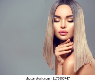 Trendy Fashion Hairstyle, Haircut, Ombre Dyed Hair. Beauty Model Girl With Perfect Healthy Hair And Beautiful Makeup Posing In Studio, Young Woman Portrait On Grey Background