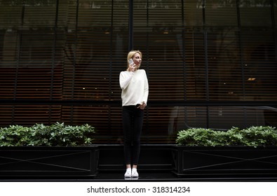 Trendy Female Hipster Have Smart Phone Conversation While Standing Outdoors In Urban Setting On Black Blank Copy Space Background For Your Text,young Business Woman Talking On Her Mobile Phone In City