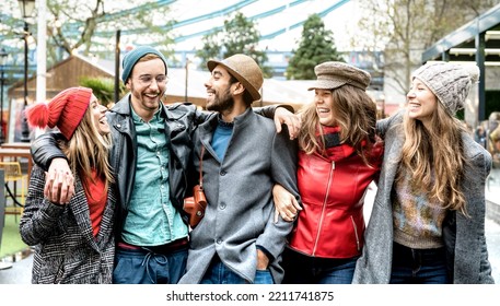 Trendy Friends Group Walking At London City Center - Next Generation Life Style Concept On Multicultural Young People Wearing Winter Fashion Clothes Having Fun Together In UK - Focus On Mid Guy