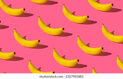 Trendy fruit pattern made of fresh banana on light pastel pink background. Minimal banana pattern layout. Nature summer background concept. - Powered by Shutterstock