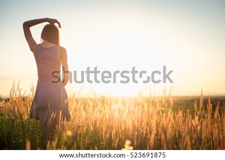 Similar – Image, Stock Photo Woman, both hands in the hair, back view