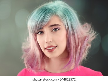 Trendy hairstyle ideas  Young woman and mint hair color blurred background