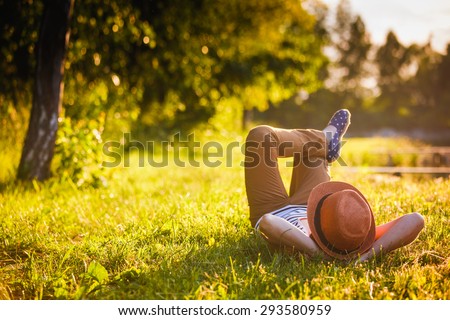 Trendy Hipster Girl Relaxing on the Grass