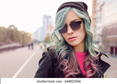 Trendy ideas Young woman and mint color accent in hairstyle outdoor 