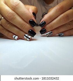 trendy manicure design in the style of minimalism. In manicure, trendy stylish geometric shapes, haze marble technique. Black, whate , gel polish - Shutterstock ID 1811032432