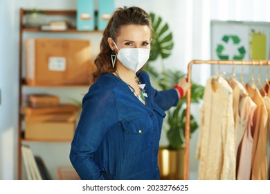 trendy middle aged small business owner woman with ffp2 mask in the office. - Powered by Shutterstock