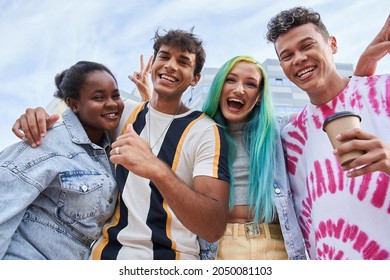 Trendy millennial people laughing out loud and posing to the camera