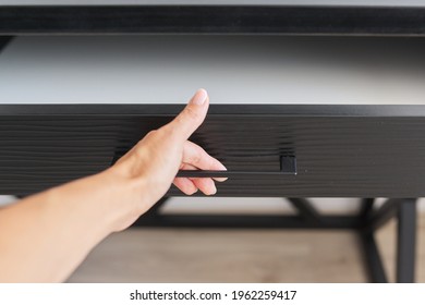 Trendy modern furniture, tube, woman's hand opening the top drawer - Shutterstock ID 1962259417